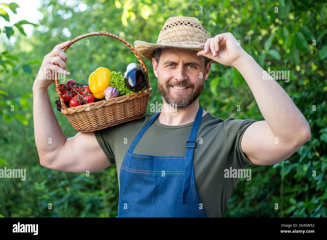 happy man in straw hat hold basket full of vegetables Stock Photo - Alamy