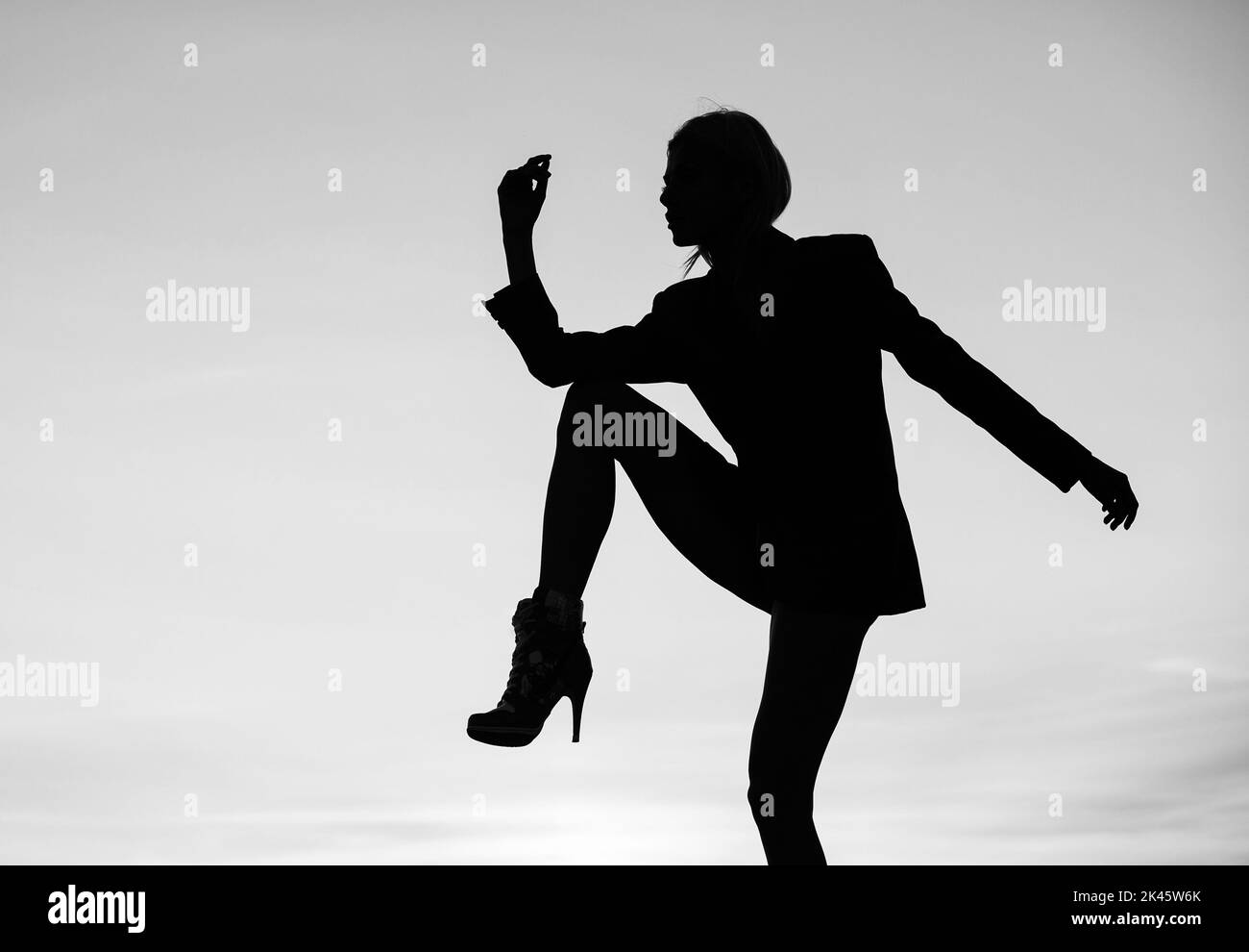 Start dancing. Dance girl on evening sky. Dancing silhouette. Woman