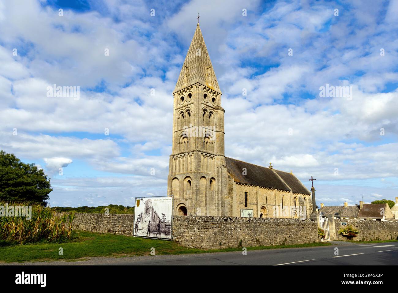 Church of Notre-Dame de l'Assomption de Colleville, with poster-sized photo of Allied advance during WW II, Colleville-sur-Mer, Normandy, France Stock Photo