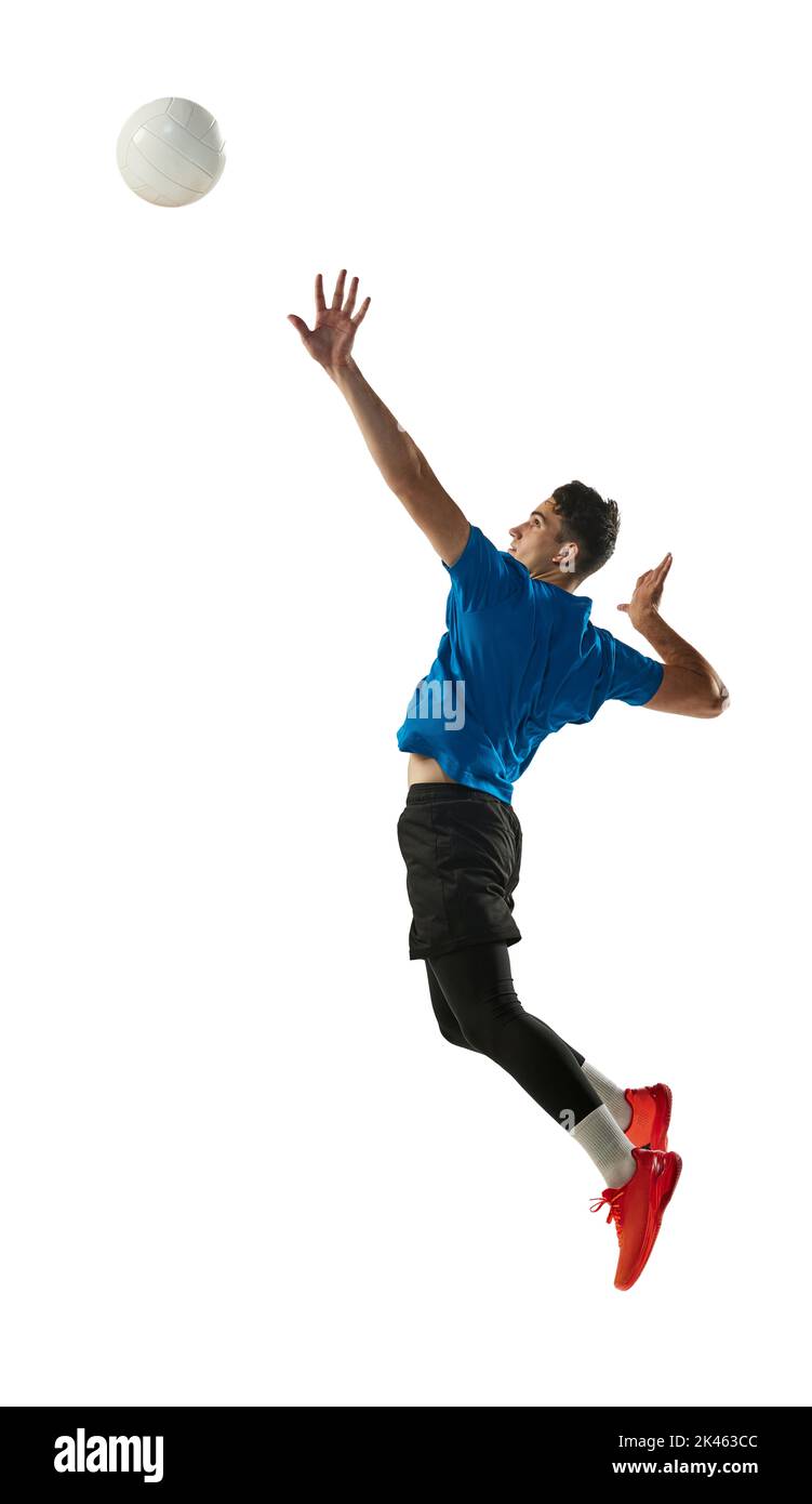 Male professional volleyball player in sports uniform training with