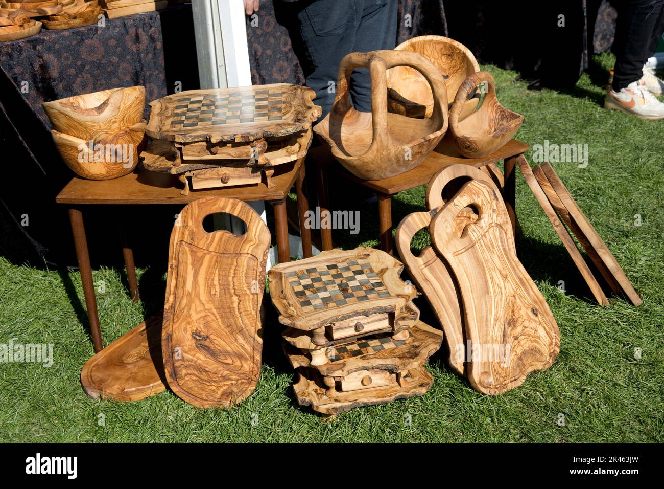 Carved Olive wood Olea europaea products including bowls, cutting boards and chess boards  at autumn show Three Counties Showground, Great Malvern, UK Stock Photo