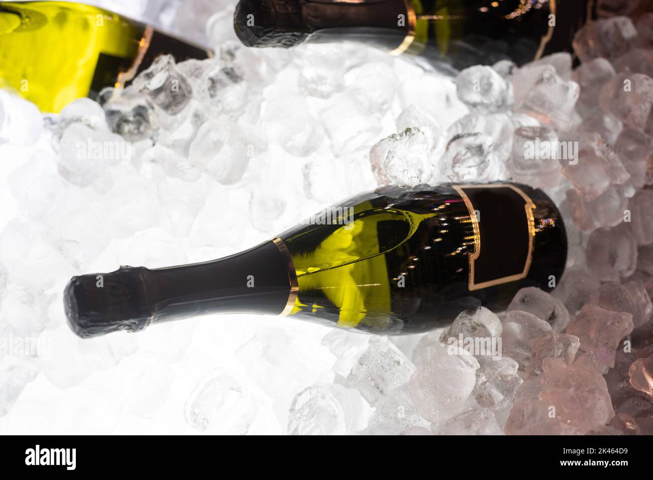 bottles of sparkling wine in ice Stock Photo Alamy