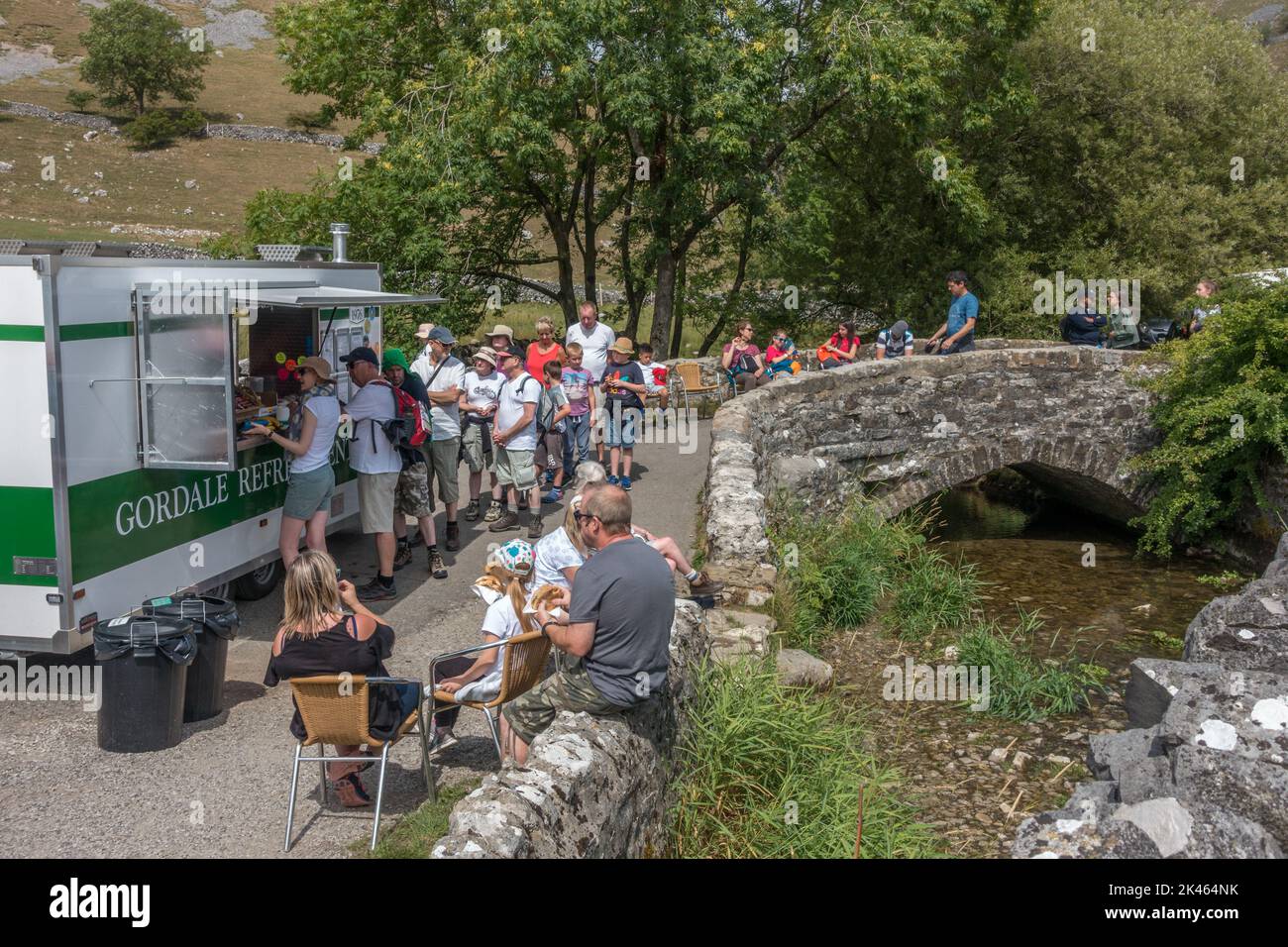 Ice cream van and queue at Gordale Scar on a hot day. Yorkshire Dales National Park, UK Stock Photo