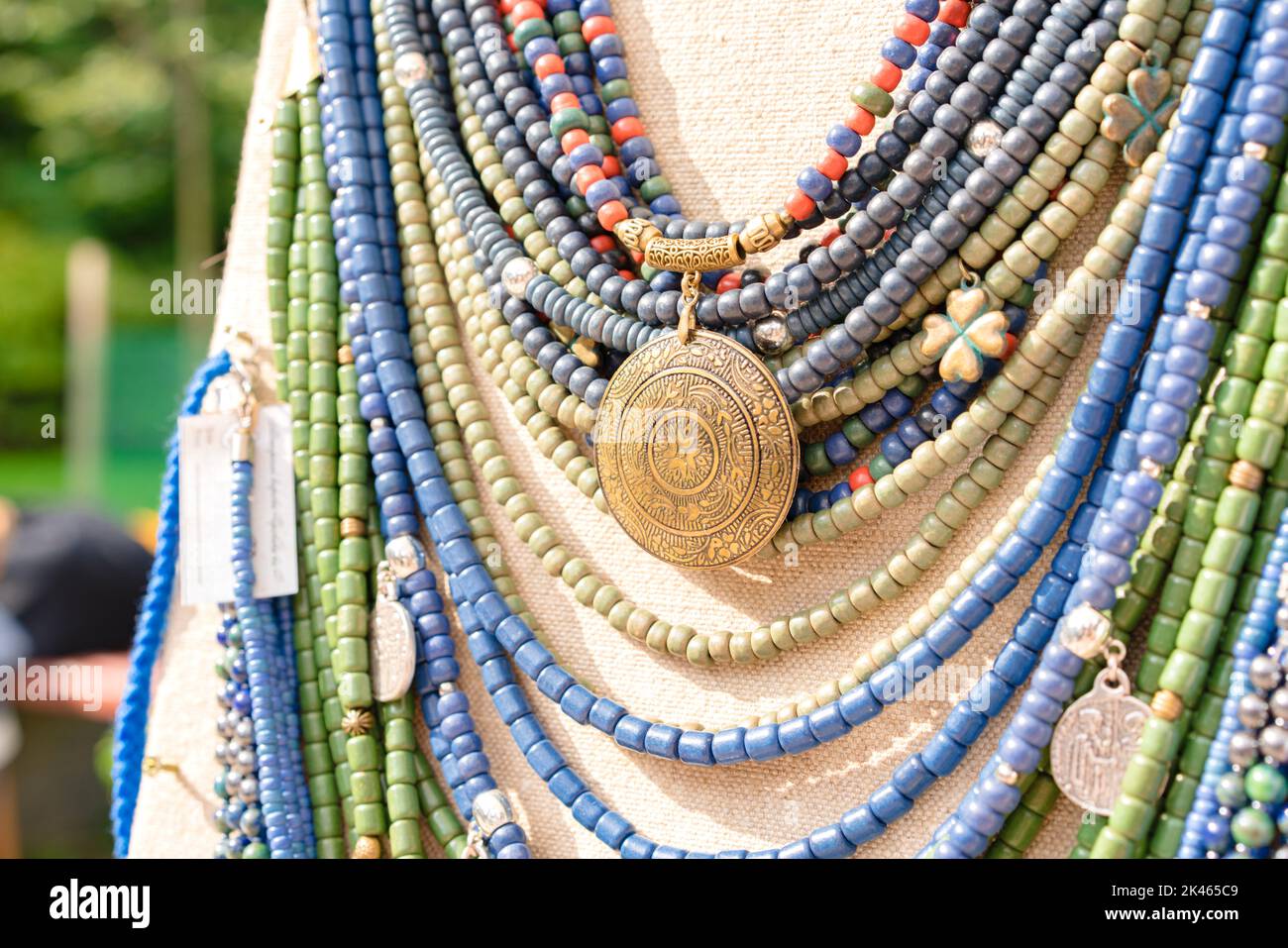 Traditional Ukrainian ethnic style jewelry made with ceramic beads. Exclusive handmade necklaces at souvenir stall or street Sunday market. Selective Stock Photo