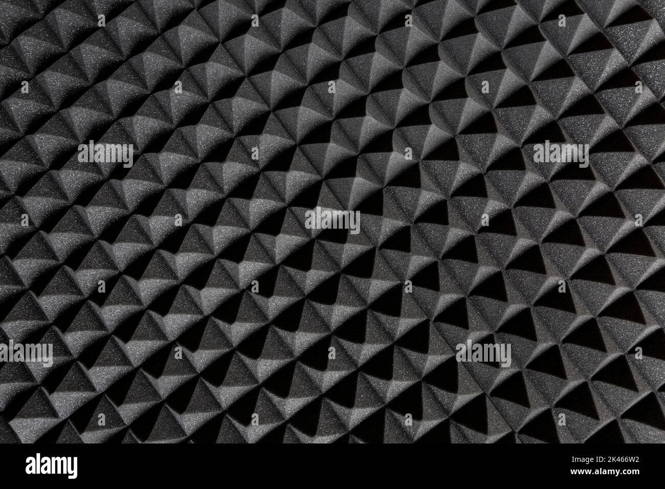 Acoustic insulation foam panel. Studio audio soundproofing. Dark background in the form of a pattern. Stock Photo
