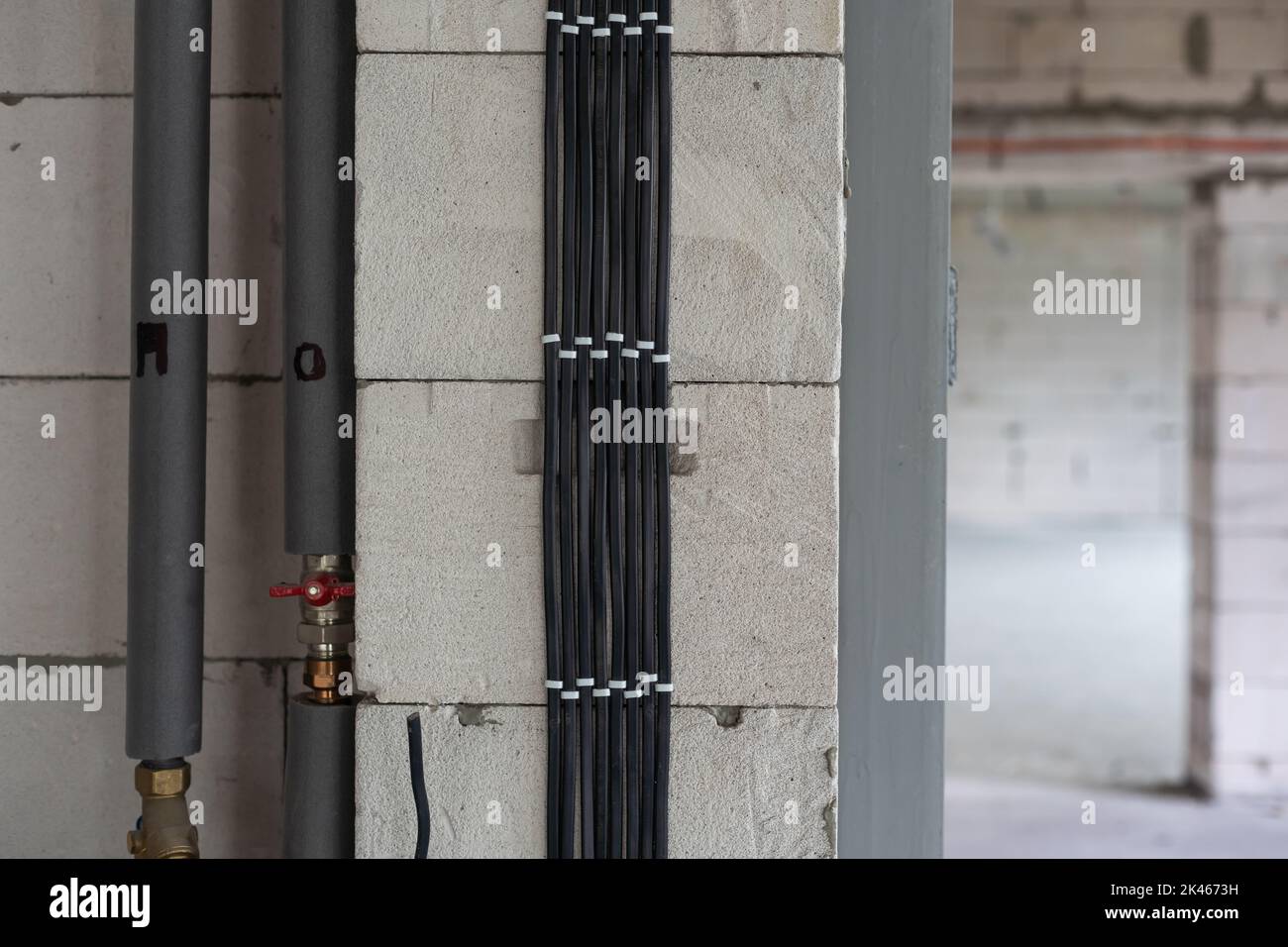 pipes under construction, visible water pipes in the wall Stock Photo