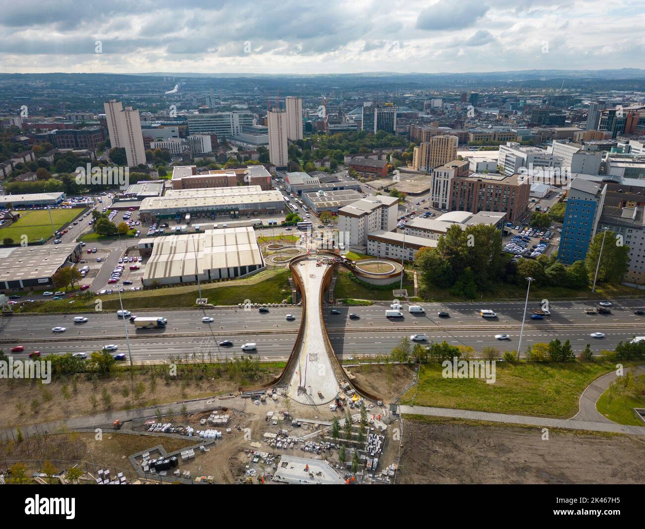 Aerial view of new pedestrian footbridge crossing M8 motorway at Sighthill in Glasgow, Scotland, UK Stock Photo