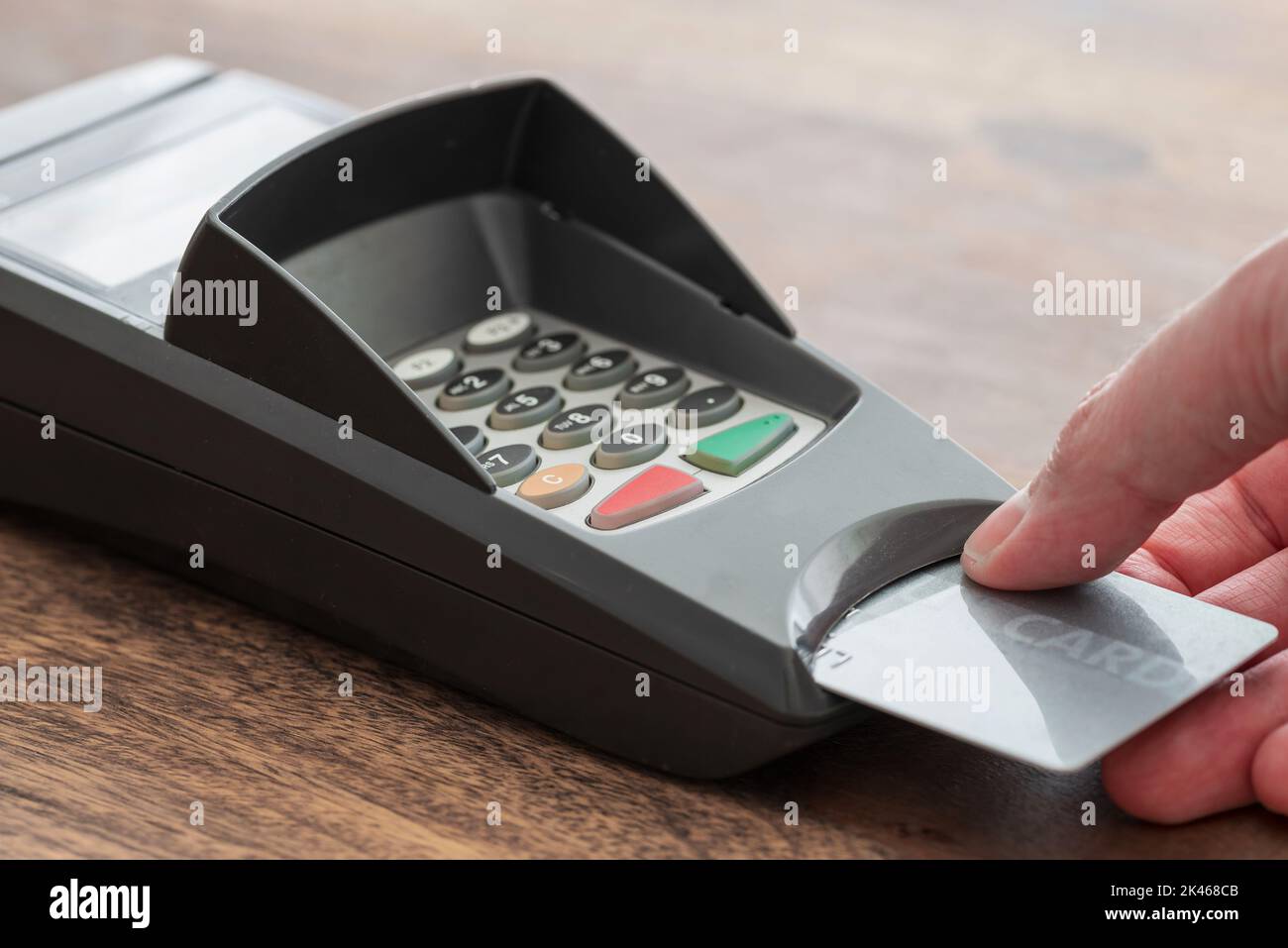 close-up view of person insert credit card or debit card into card reader, cashless payment concept Stock Photo