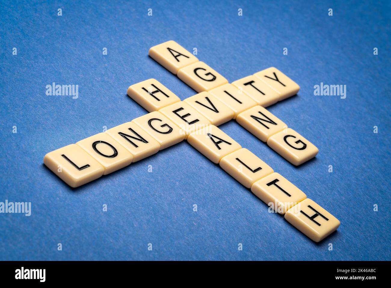 longevity, health and aging crossword word in ivory letter tiles