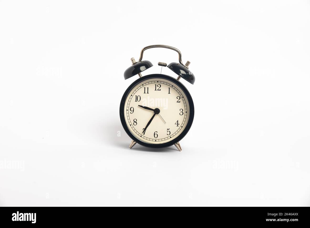 black vintage alarm clock isolated on white background, Time concept, 9