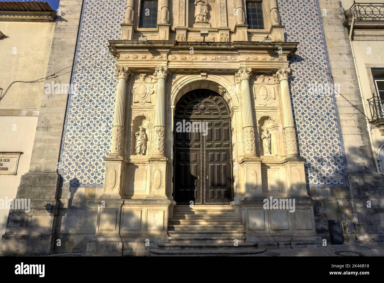 Aveiro, Portugal - August 14, 2022: Close up of door and surrounding stone sculpture and tiled frontage of church Santa Casa da Misericordia de Aveiro Stock Photo