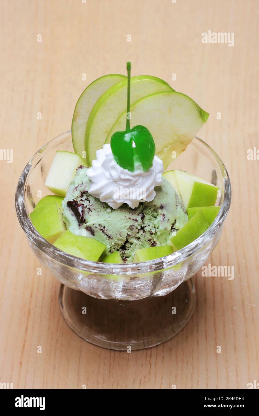 Choco mint ice cream with fresh fruit classically decorated on wooden table for dessert Stock Photo