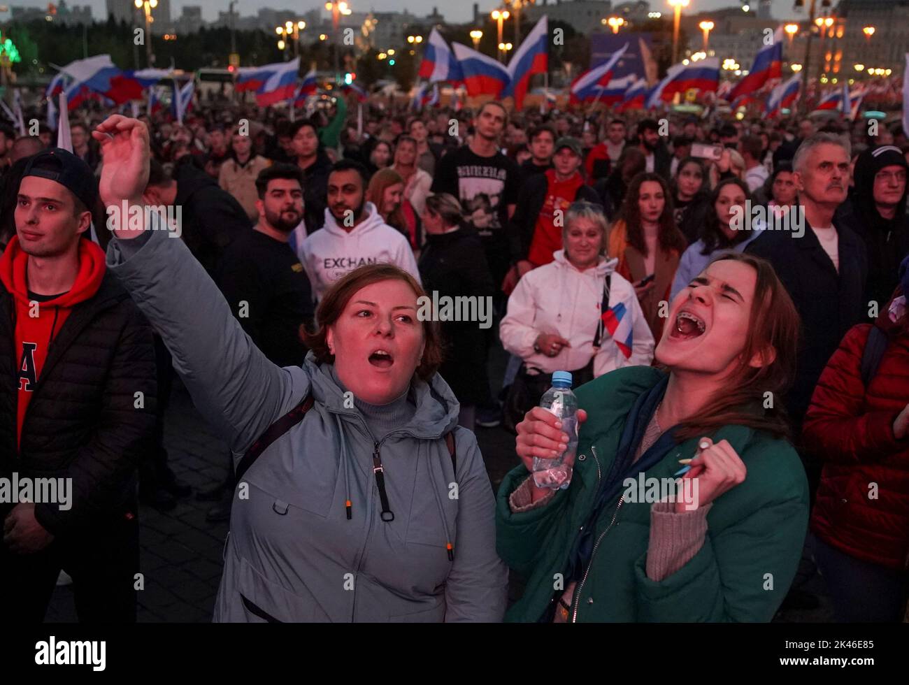People attend a concert marking the declared annexation of the Russian-controlled territories of four Ukraine's Donetsk, Luhansk, Kherson and Zaporizhzhia regions, after holding what Russian authorities called referendums in the occupied areas of Ukraine that were condemned by Kyiv and governments worldwide, in central Moscow, Russia, September 30, 2022. REUTERS/REUTERS PHOTOGRAPHER Stock Photo
