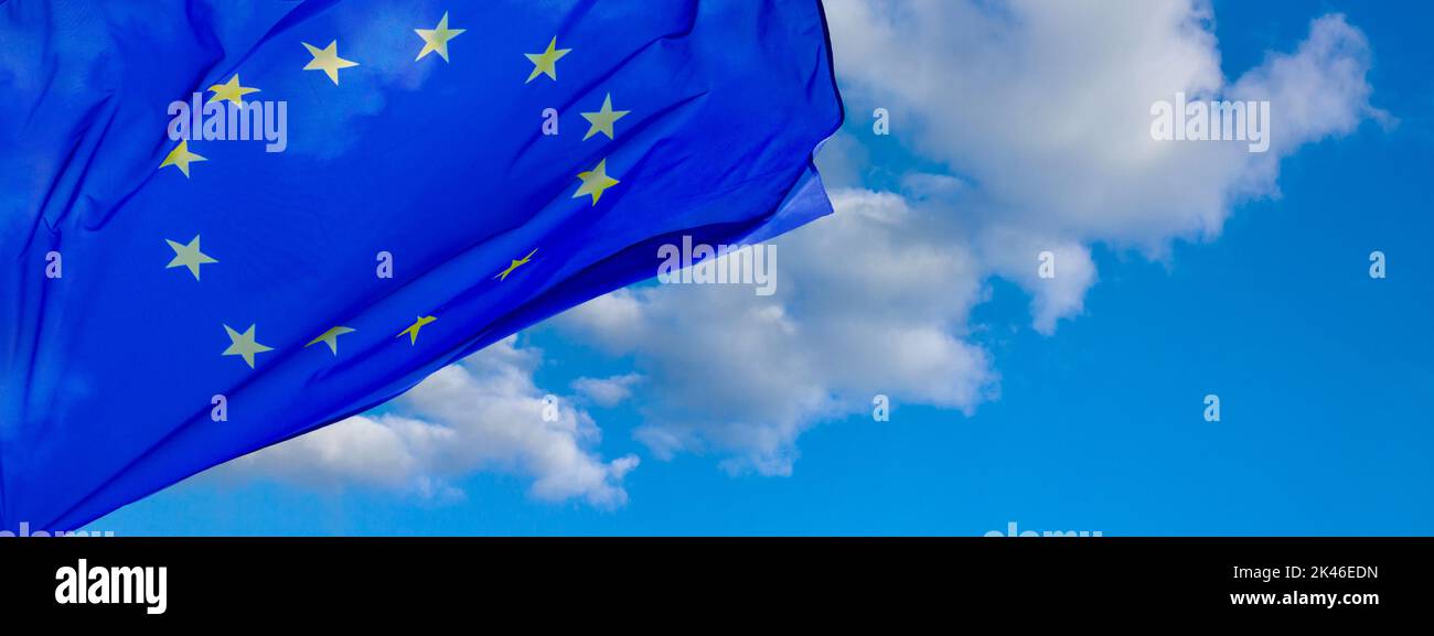 Flag of the European Union waving in the wind on flagpole against the ...