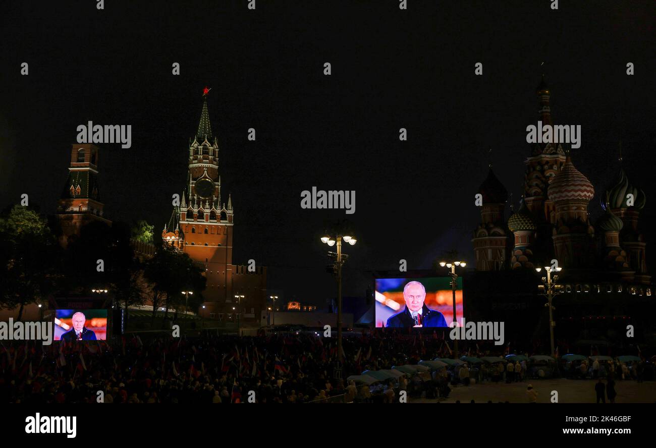 Russian President Vladimir Putin is seen on screens during a concert marking the declared annexation of the Russian-controlled territories of four Ukraine's Donetsk, Luhansk, Kherson and Zaporizhzhia regions, after holding what Russian authorities called referendums in the occupied areas of Ukraine that were condemned by Kyiv and governments worldwide, near the Kremlin and Red Square in central Moscow, Russia, September 30, 2022. REUTERS/REUTERS PHOTOGRAPHER Stock Photo