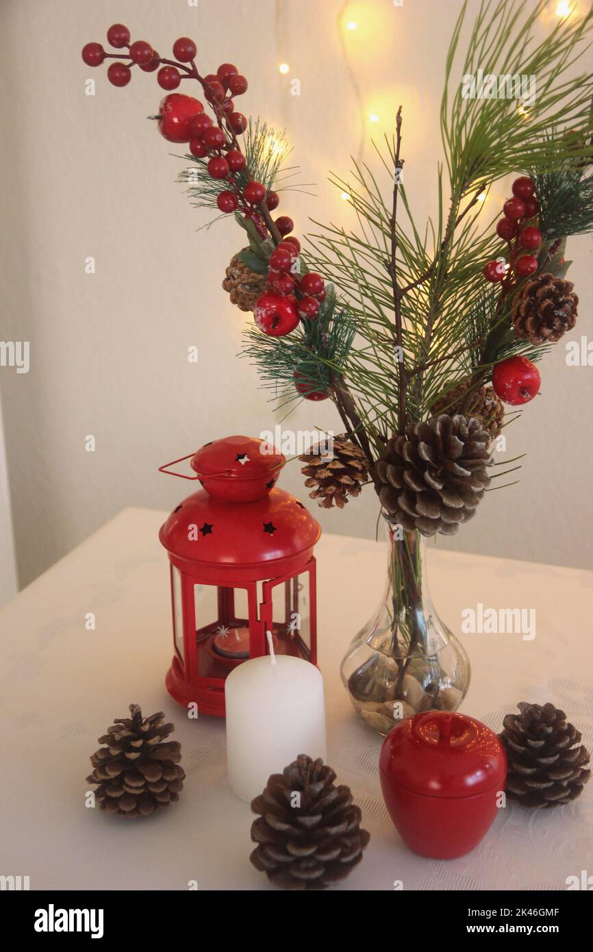 Christmas concept, Christmas interior decoration idea, lantern, candle, tree branch, pine cone Stock Photo