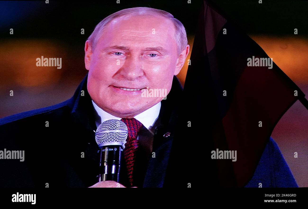 Russian President Vladimir Putin is seen on a screen during the broadcast of a concert marking the declared annexation of the Russian-controlled territories of four Ukraine's Donetsk, Luhansk, Kherson and Zaporizhzhia regions, after holding what Russian authorities called referendums in the occupied areas of Ukraine that were condemned by Kyiv and governments worldwide, near Red Square in central Moscow, Russia, September 30, 2022. REUTERS/REUTERS PHOTOGRAPHER Stock Photo