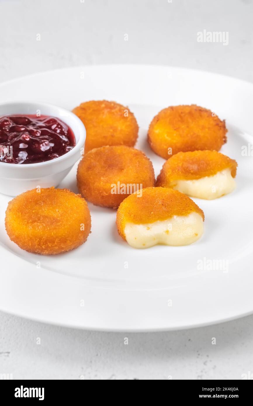 Deep fried camembert nuggets with cranberry sauce Stock Photo Alamy