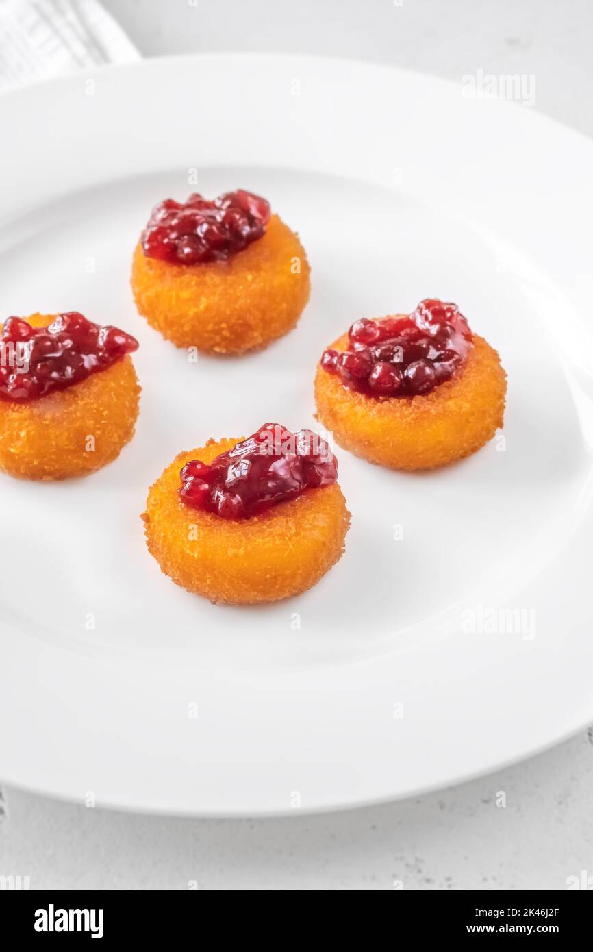 Deep fried camembert nuggets with cranberry sauce Stock Photo Alamy