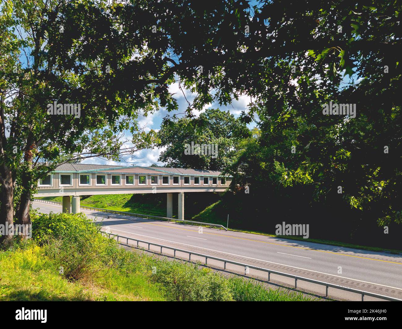 Angola, New York - Sep 8, 2022: Landscape Wide View of Angola Travel Service Plaza Bridge, which Cuts thru I-90 Thruway from the Parking Lot to the Sh Stock Photo