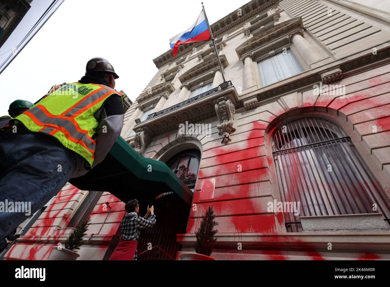 People stand outside the building of the Consulate General of the Russian Federation after it was vandalized with red paint in Manhattan, New York City, U.S., September 30, 2022.  REUTERS/Andrew Kelly Stock Photo