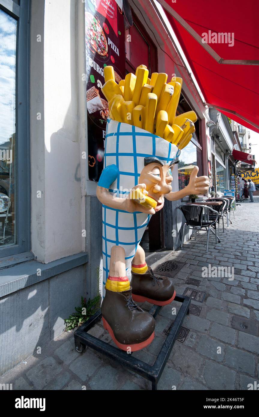 Big cone of typical fried chips (frites) for advertisement outside a restaurant, Brussels, Belgium Stock Photo