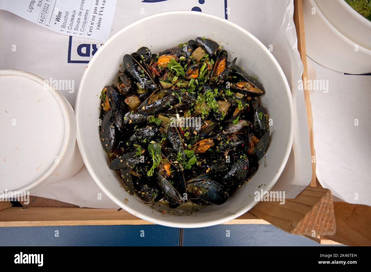Mussels with herbs and vegetables in a seafood restaurant, Brussels, Belgium Stock Photo