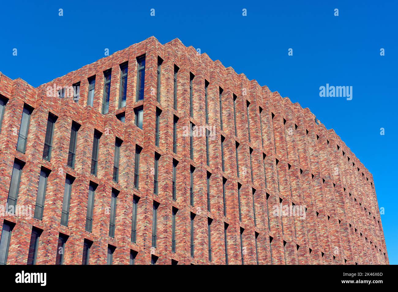 Brick facade under a blue sky Stock Photo