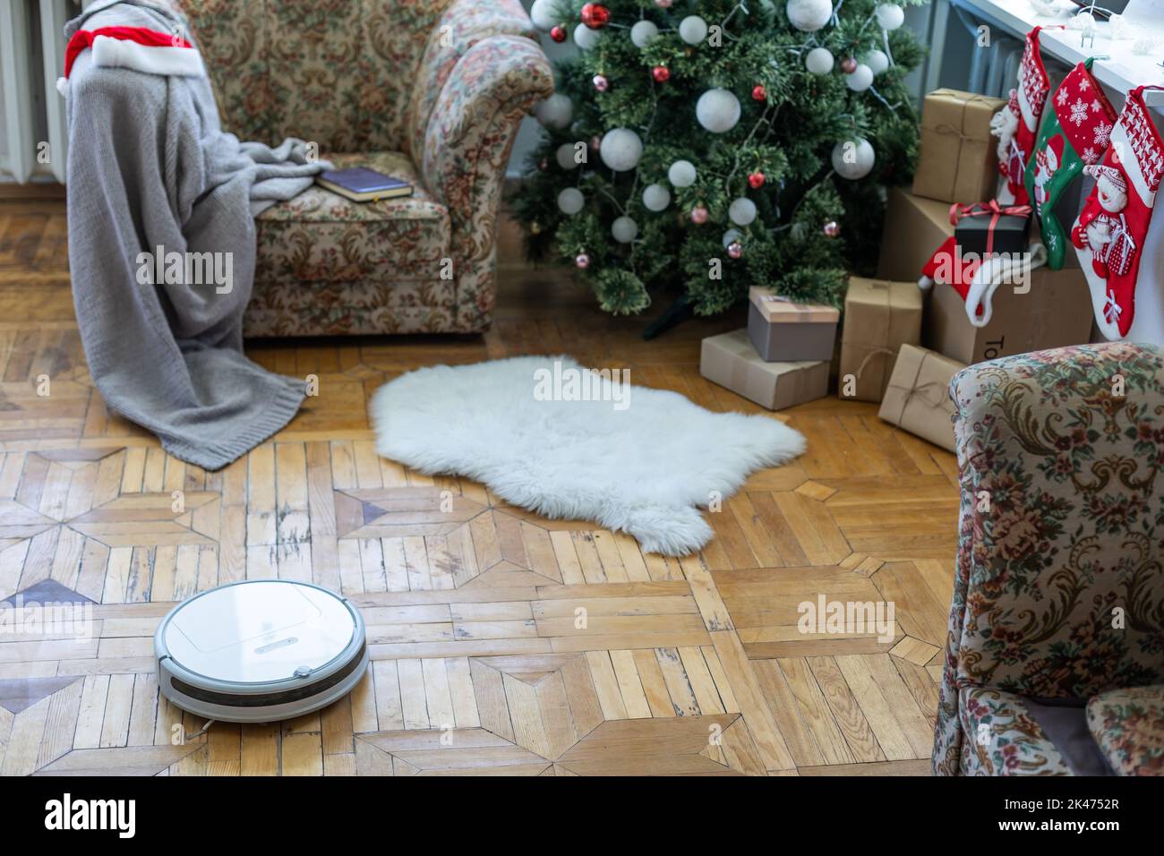 Smart home. Robot vacuum cleaner performs automatic cleaning of the