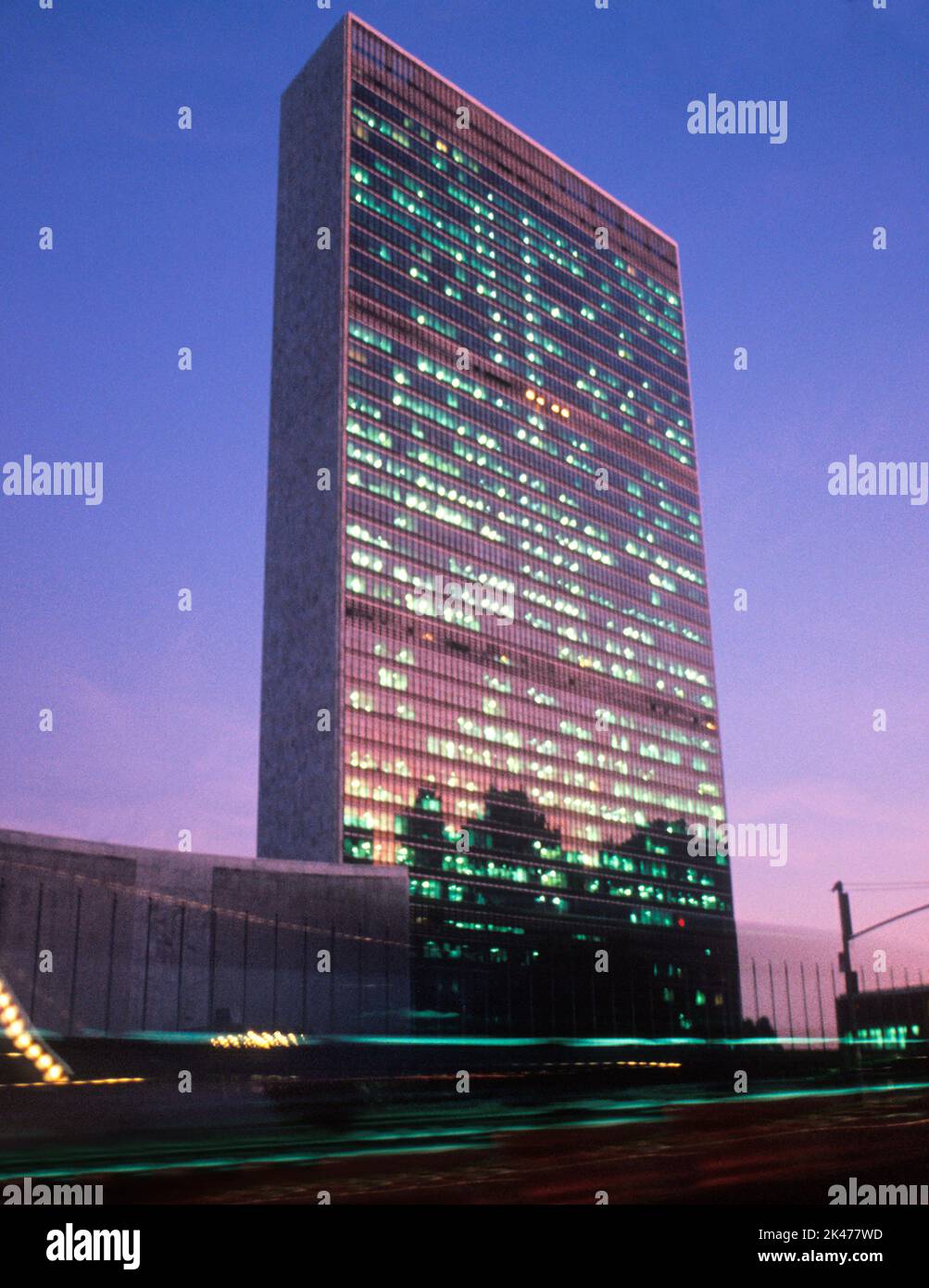 United Nations Secretariat Building at UN Headquarters in New York City at night. Turtle Bay, Midtown Manhattan USA Stock Photo