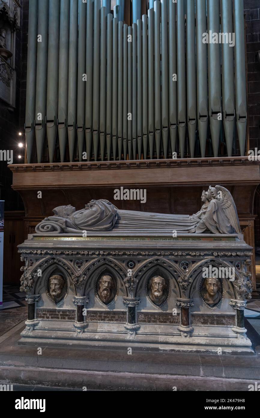 Chester, United Kingdom - 26 August, 2022: vertical view of bishop's tomb and church organ pipes inside the historic Chester Cathedral Stock Photo