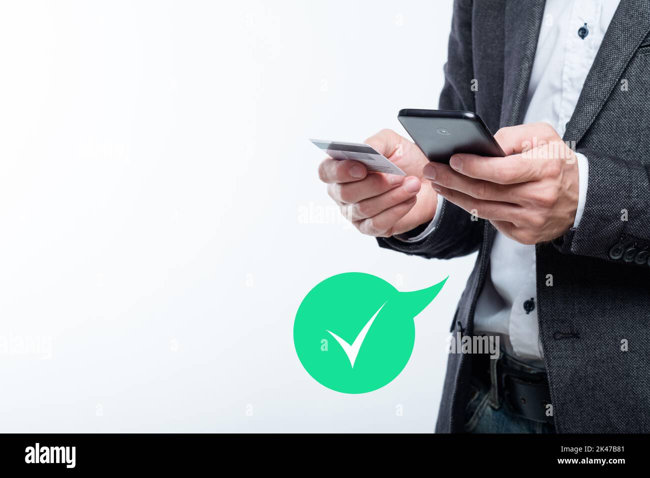 Fintech business. Mobile banking. Payment confirmation. Successful ecommerce transfer. Man using credit card phone app with approved status green chec Stock Photo