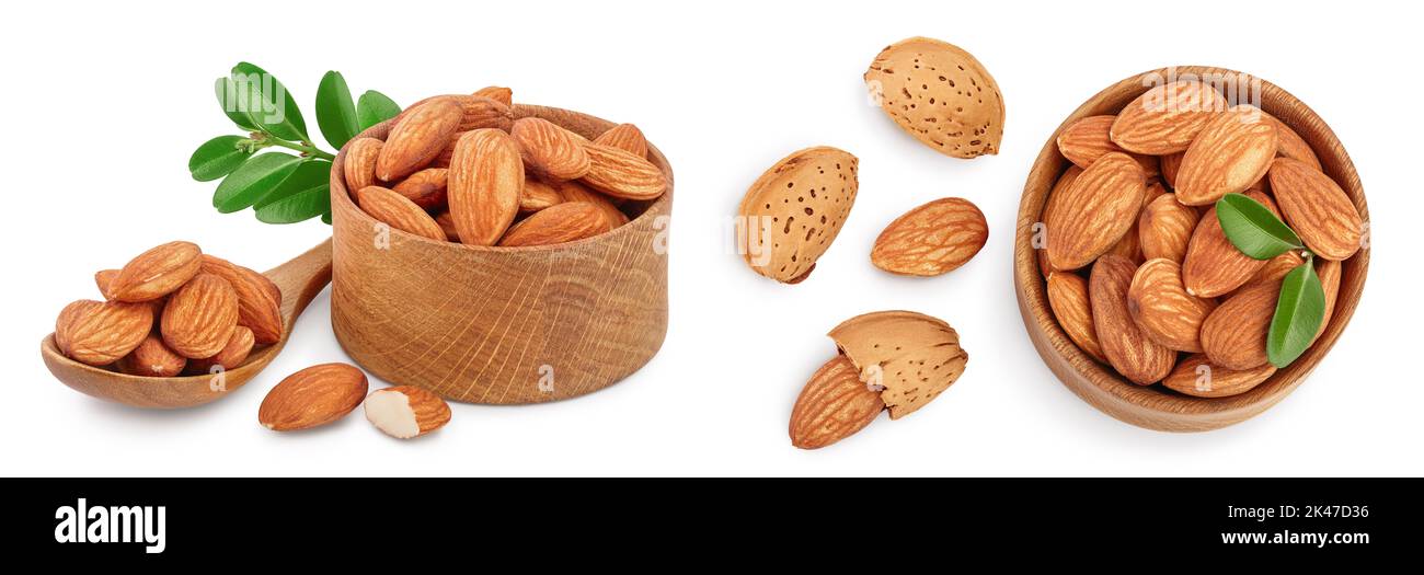 Almonds nuts with leaves in wooden bowl isolated on white background