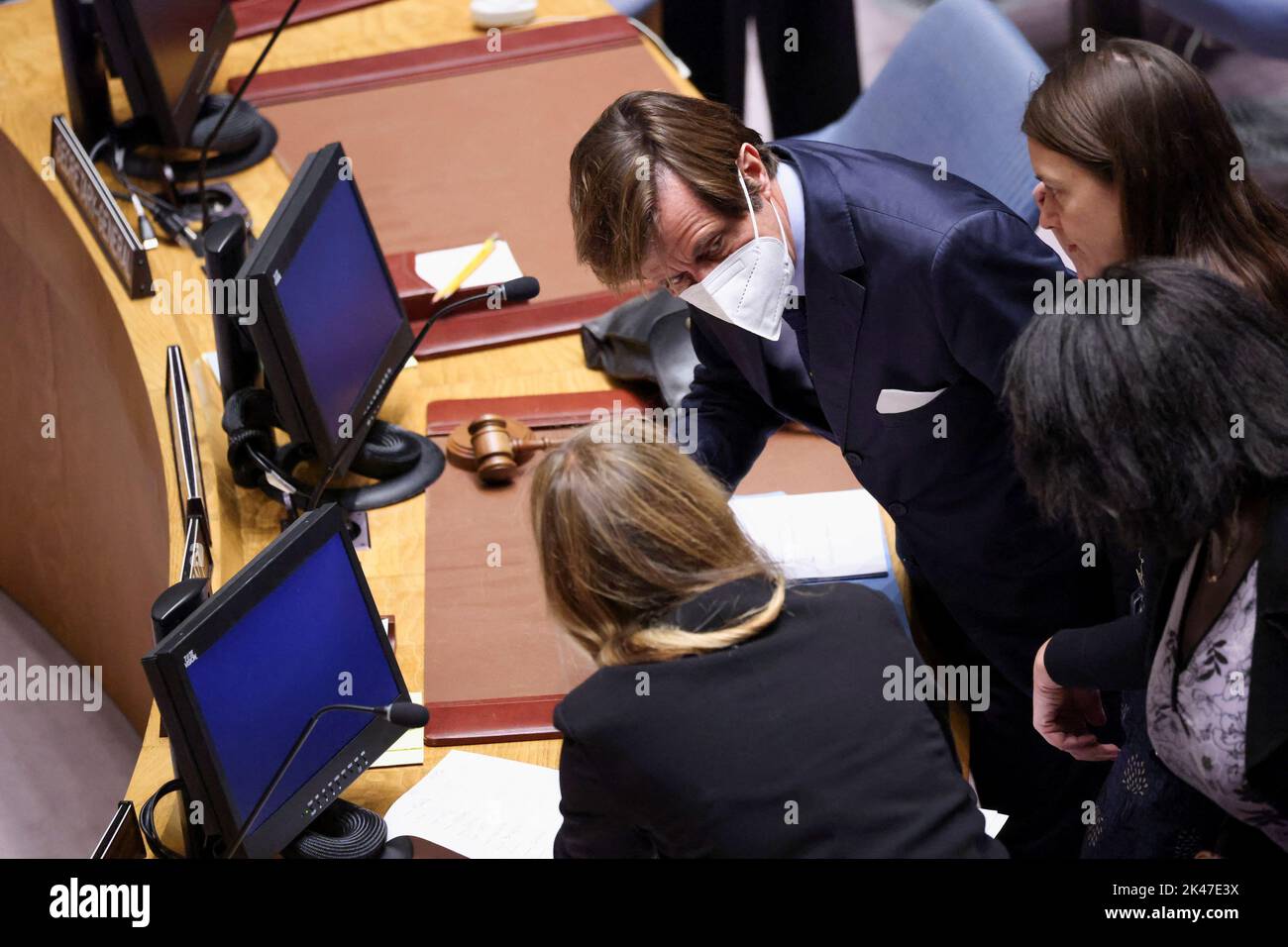 French Ambassador to the U.N. Nicolas de Riviere speaks with his delegation before a meeting at the request of Russia to discuss damage to two Russian gas pipelines to Europe, in New York, U.S., September 30, 2022. REUTERS/Andrew Kelly Stock Photo