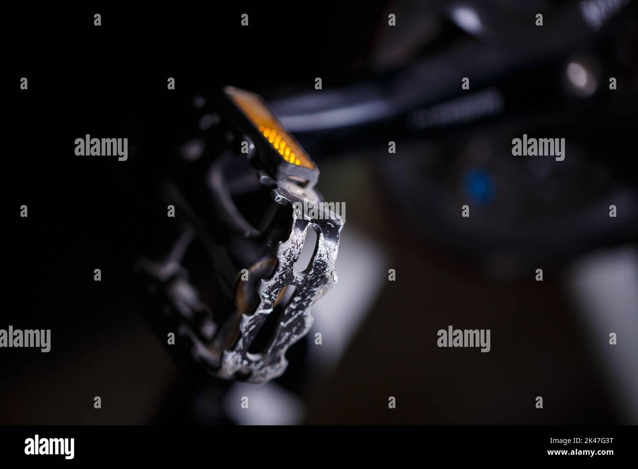 Black metal pedal on a bike with hard light. Bike accessories Stock
