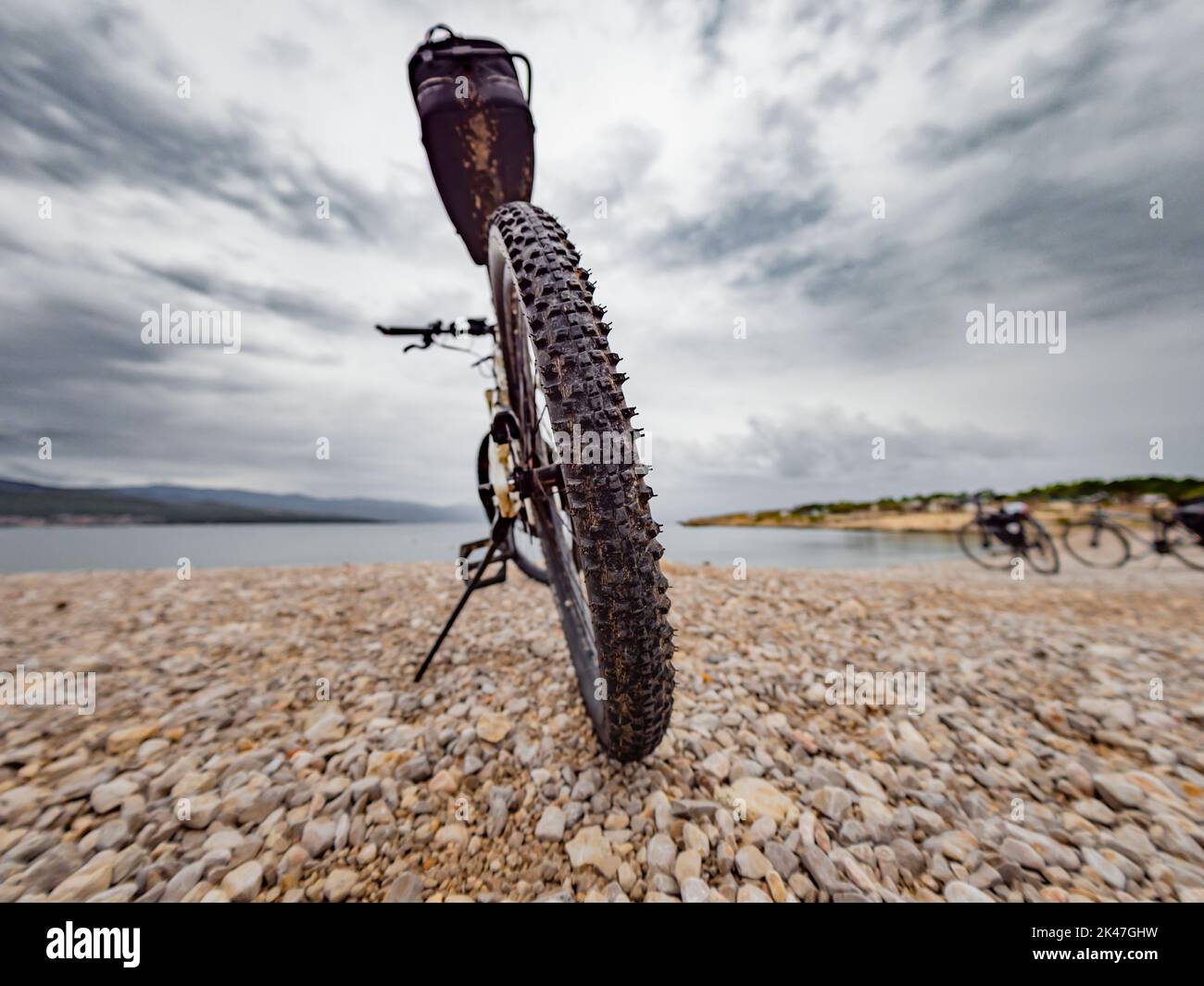 Rear tire bicycle close up near beach Stock Photo