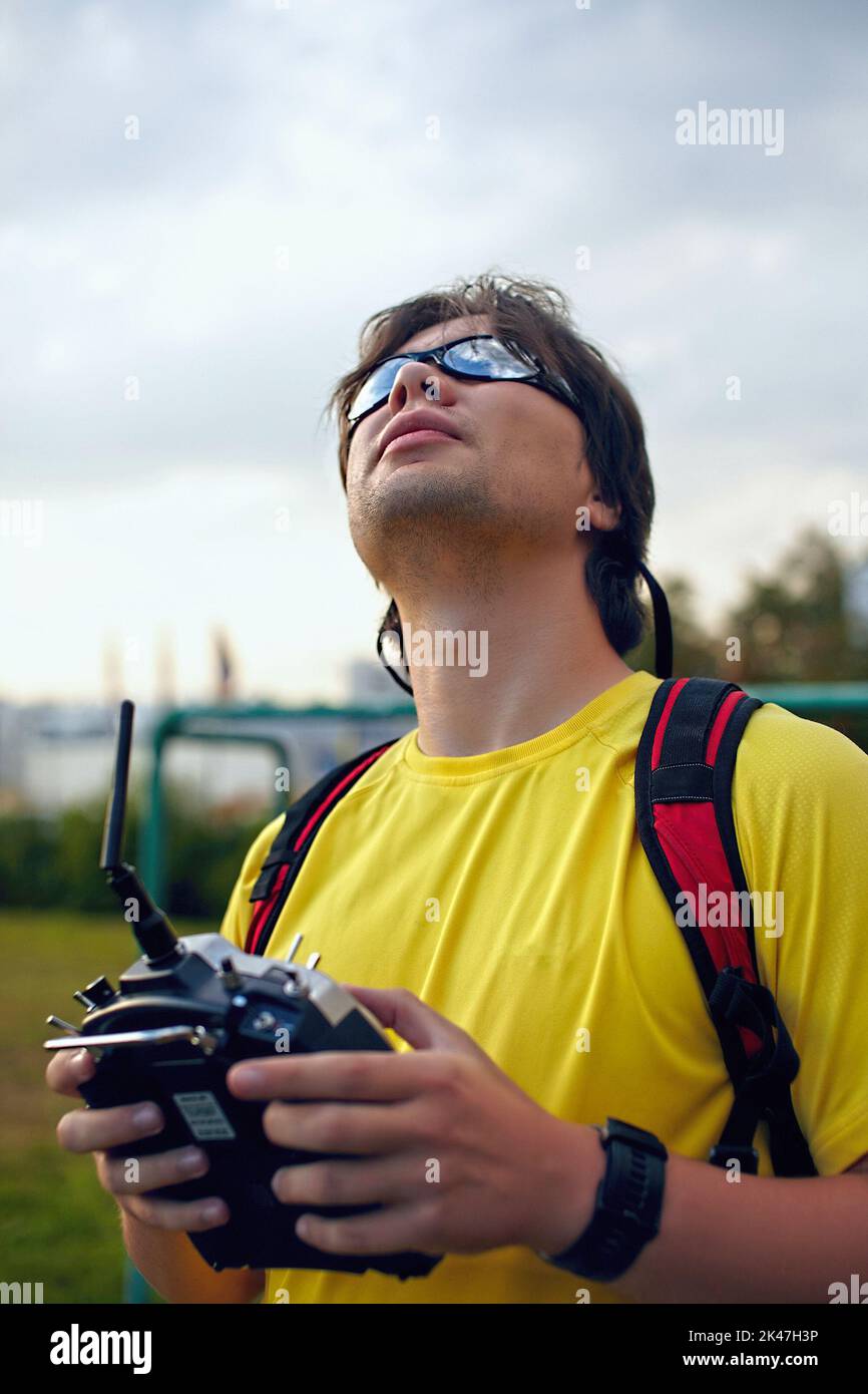 Man holding a drone remote control Stock Photo