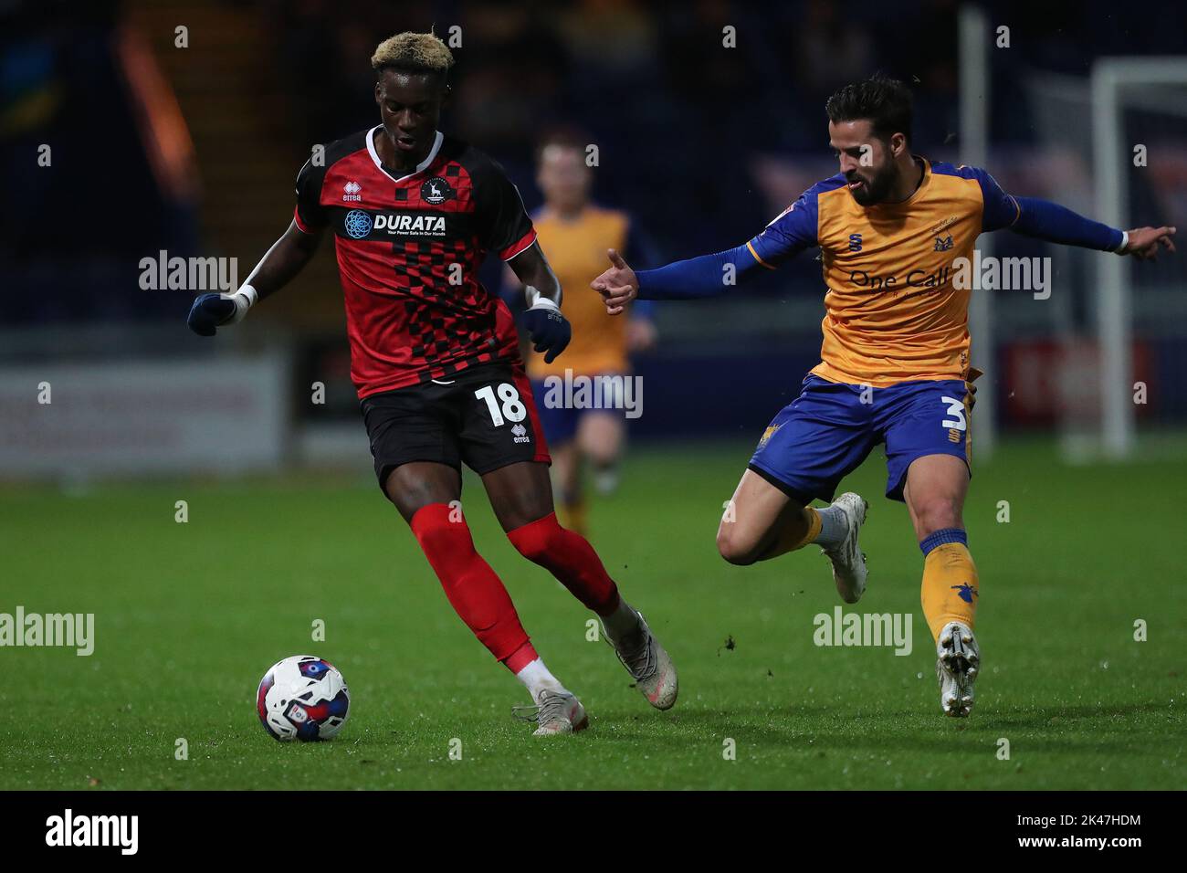 Mikael Ndjoli of Hartlepool United in action with Stephen McLaughlin of Mansfield Town during the Sky Bet League 2 match between Mansfield Town and Hartlepool United at the One Call Stadium, Mansfield on Friday 30th September 2022. (Credit: Mark Fletcher | MI News) Credit: MI News & Sport /Alamy Live News Stock Photo