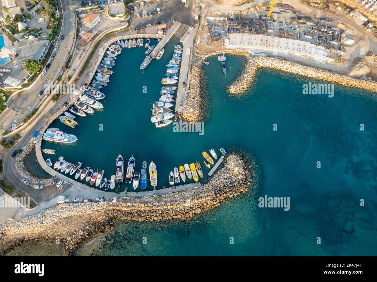 Drone aerial scenery fishing port at pernera Protaras Cyprus. Fishing boats moored in the harbour Stock Photo