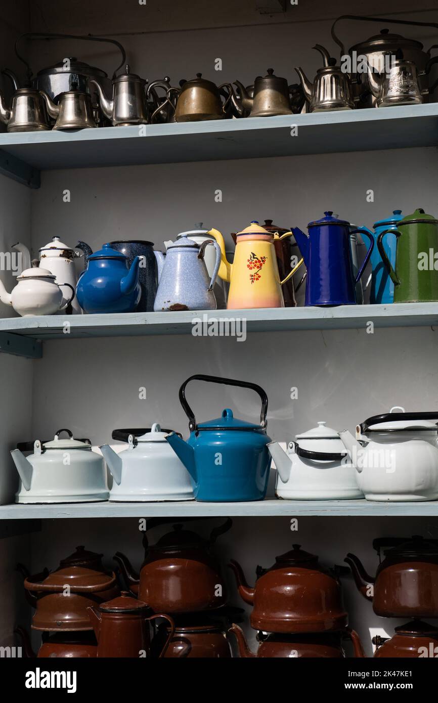 Collection of teapots in museum attracting tourists attention with multicolourness and shapes Stock Photo