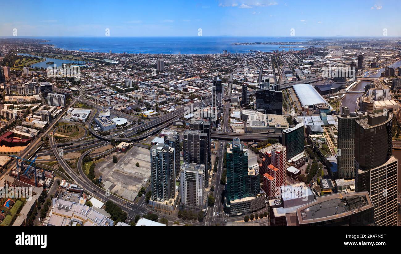 City of Melbourne cityscape panorama to Port Phillip bay port and waterfront from elevation of downtown high-rise tower. Stock Photo