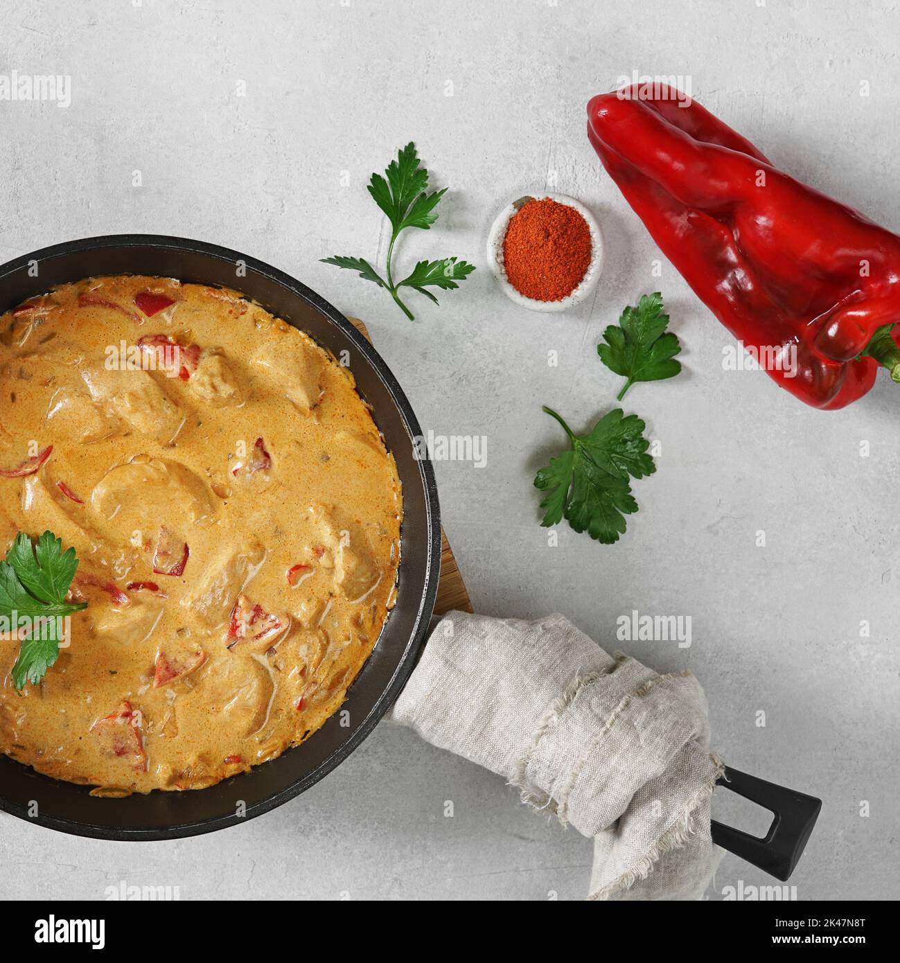Chicken paprikash dish with paprika onion bulgarian paper on pan Stock Photo