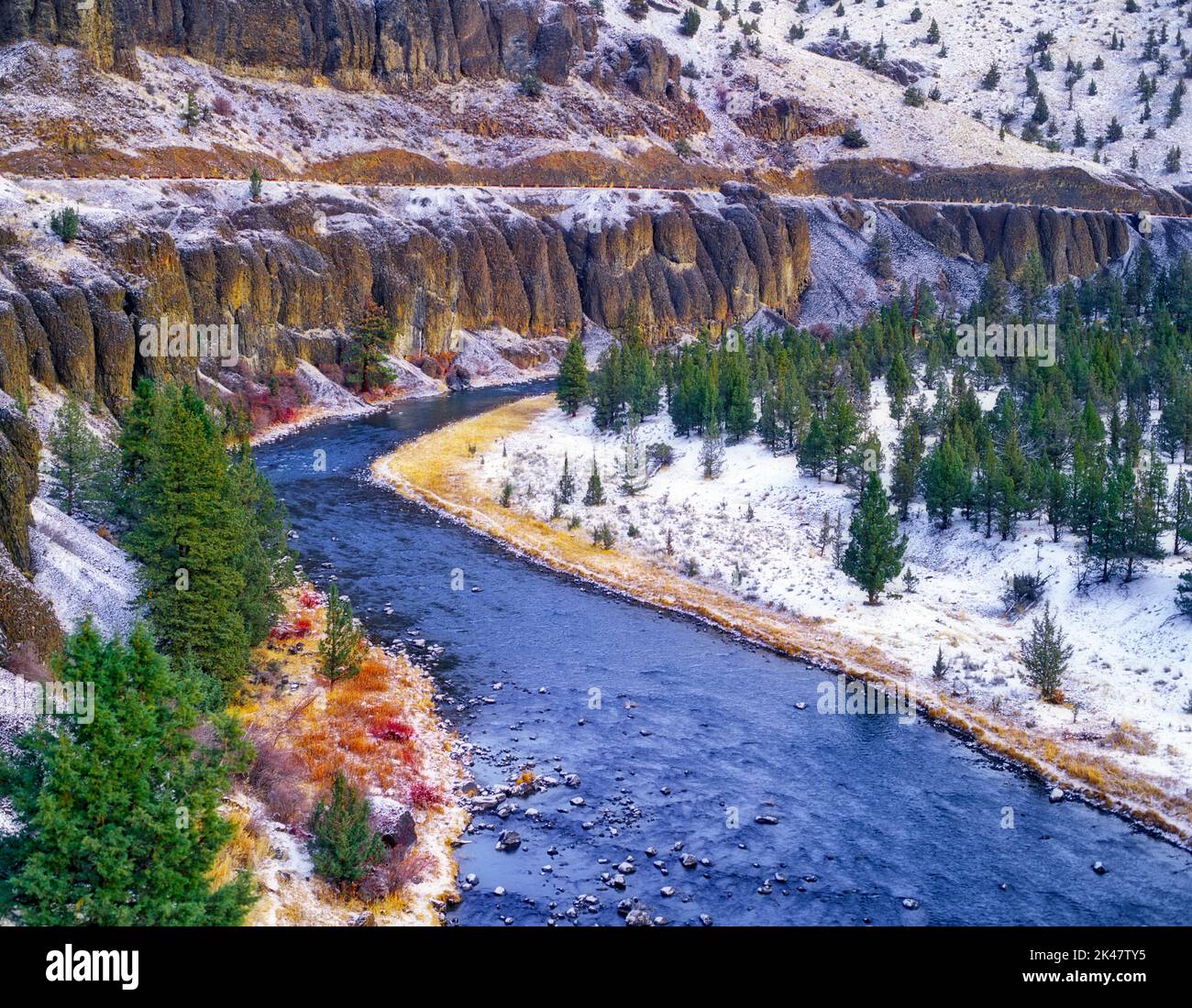 Snow and Crooked River with interesting rock formations. Stock Photo