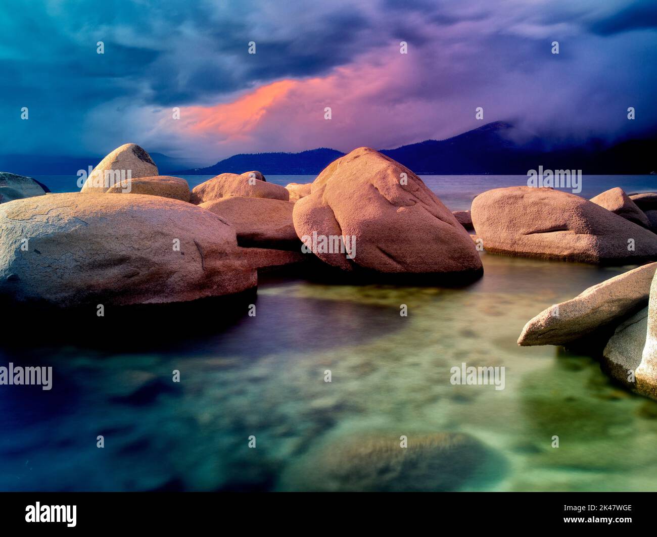 Storm clouds and granite boulders on east side of Lake Tahoe, Nevada Stock Photo