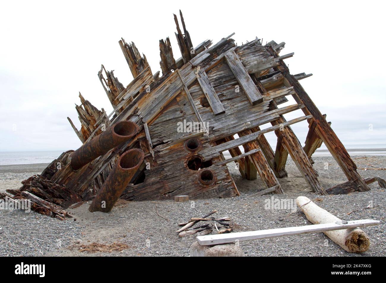 The remaining hull of the Pesuta shipwreck lying in sand north of Tlell River on East Beach in the Naikoon Provincial Park, Haida Gwaii, BC, Canada Stock Photo