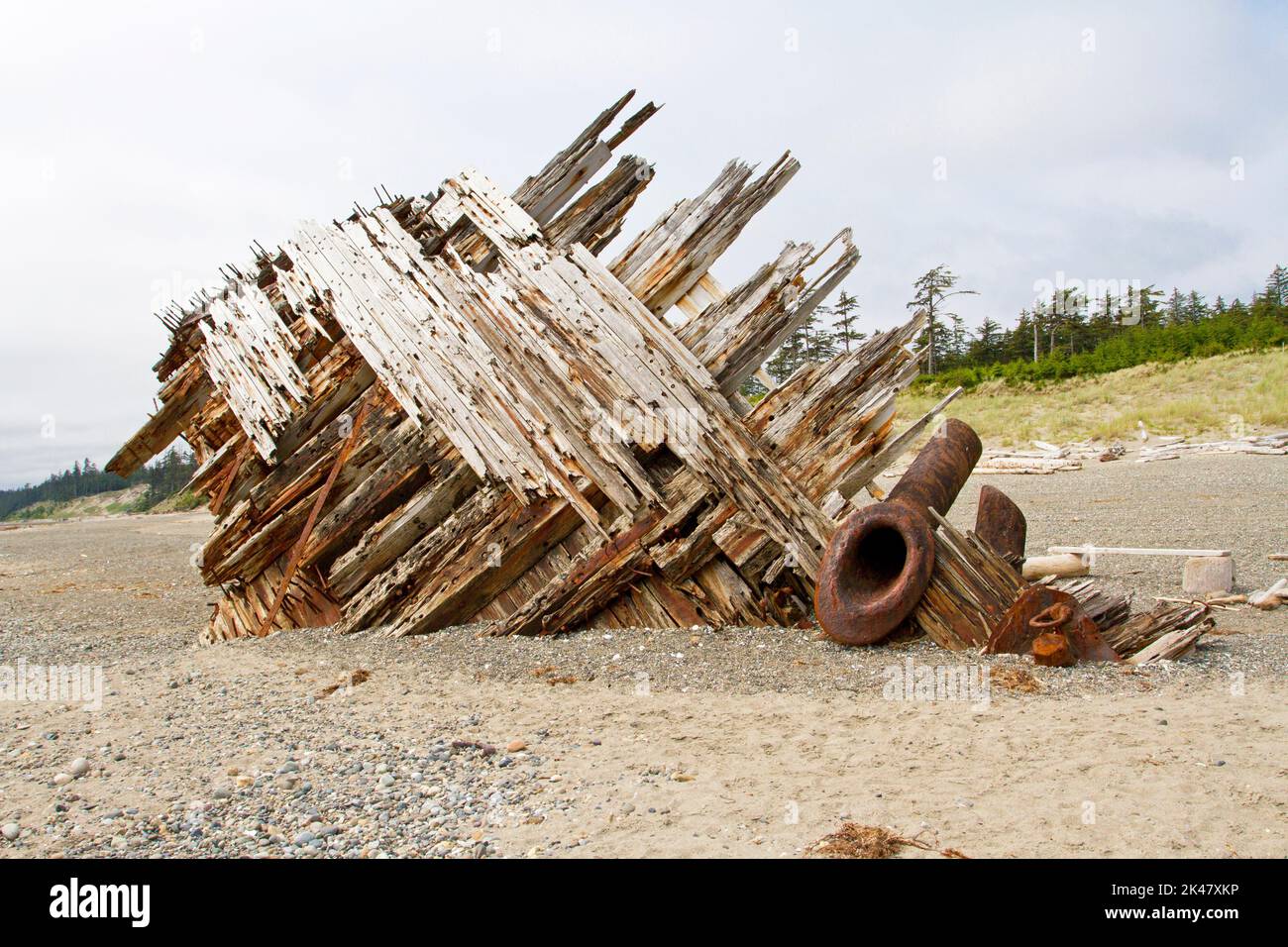 The remaining hull of the Pesuta shipwreck lying in sand north of Tlell River on East Beach in the Naikoon Provincial Park, Haida Gwaii, BC, Canada Stock Photo