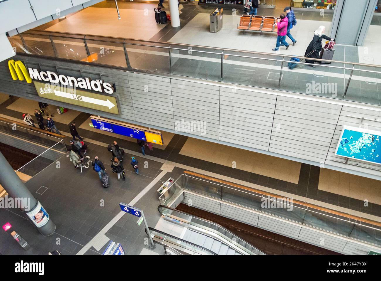 Berlin, Germany - April 2, 2015: Tourists and workers are shopping and traveling at the central station of Berlin on April 2, 2015 in the central stat Stock Photo