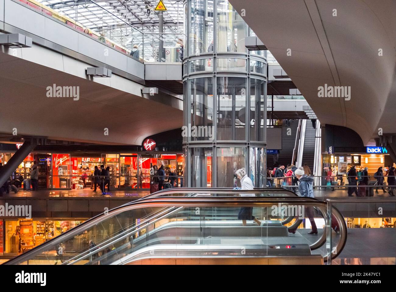 Berlin, Germany - April 2, 2015: Tourists and workers are shopping and traveling at the central station of Berlin on April 2, 2015 in the central stat Stock Photo
