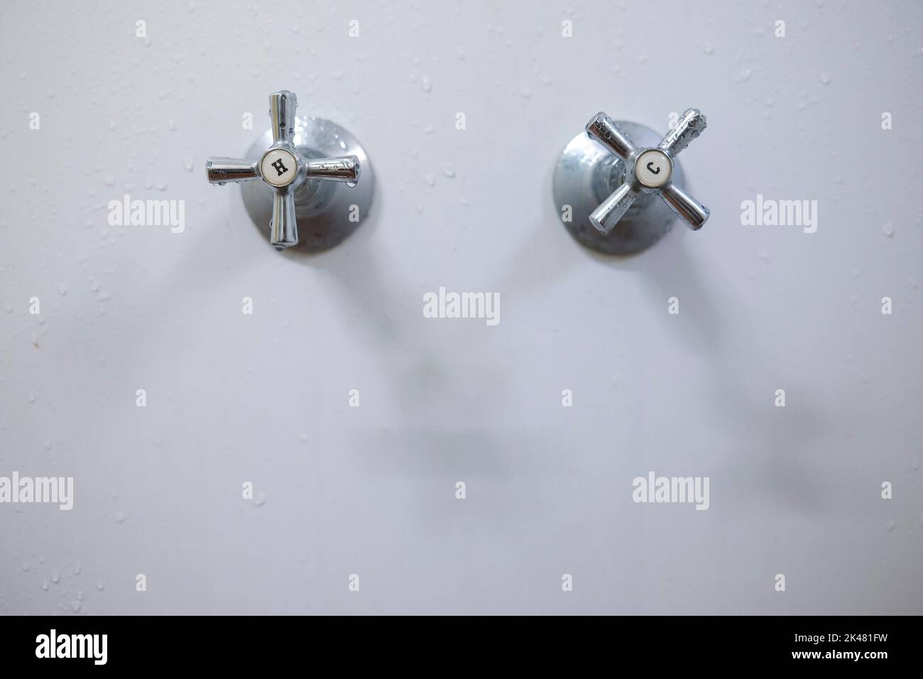 hot and cold bathroom wall faucets Stock Photo