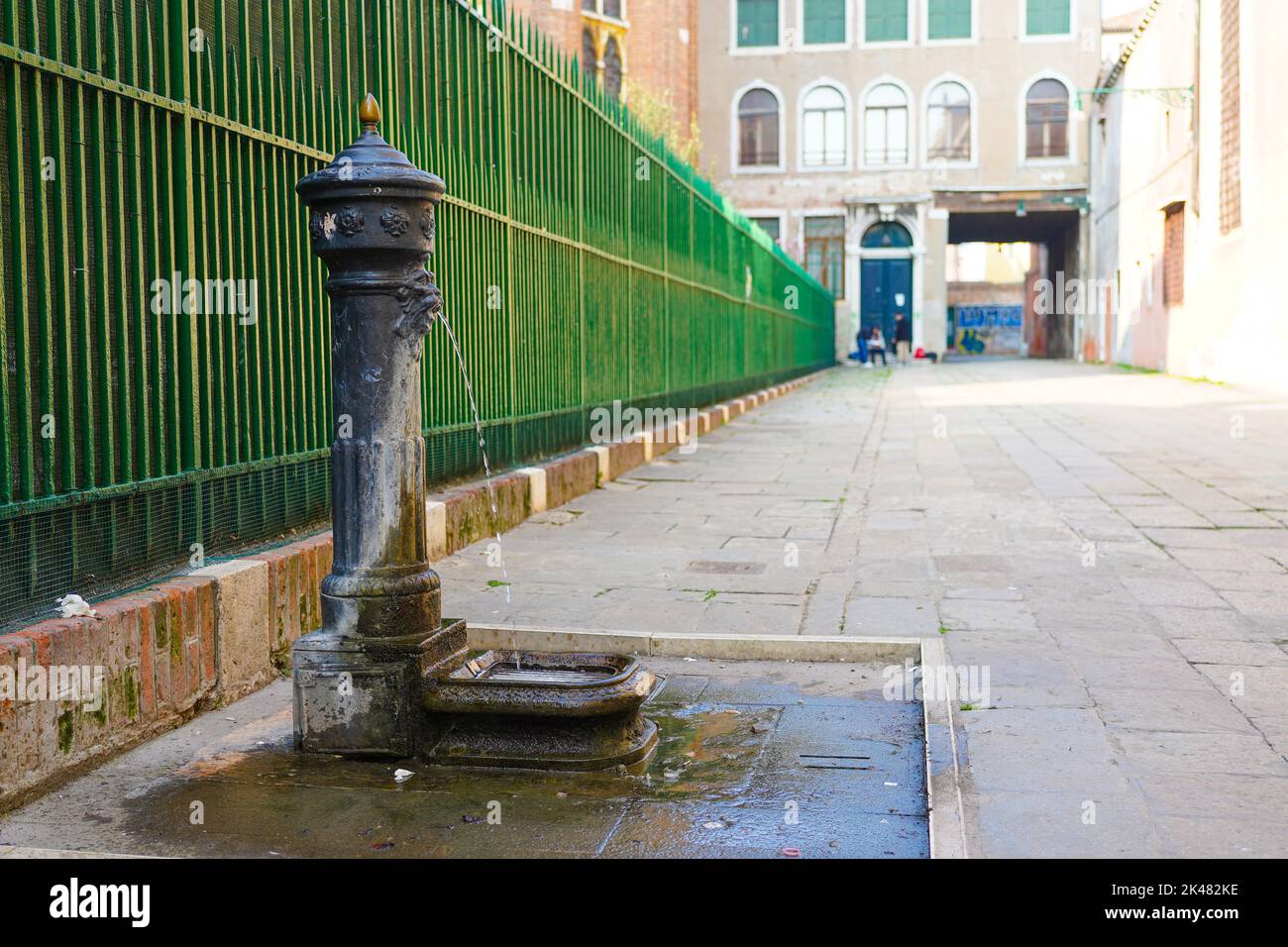 A traditional drinking fountain found all over the city of Venice, Italy Stock Photo